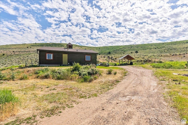 view of front of property with driveway and a gazebo