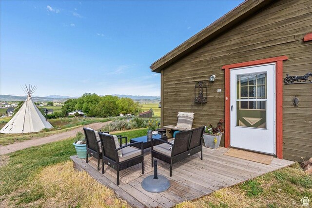 1071 S Foothill Dr E Unit 1, Kamas, UT 84036 - deck with a yard, an outdoor living space, and a mountain view