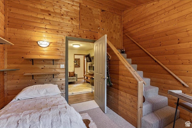 1071 S Foothill Dr E Unit 1, Kamas, UT 84036 - bedroom with wood walls, wooden ceiling, and carpet