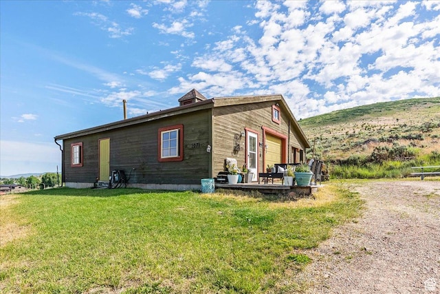 1071 S Foothill Dr E Unit 1, Kamas, UT 84036 - view of home's exterior with a lawn and a deck