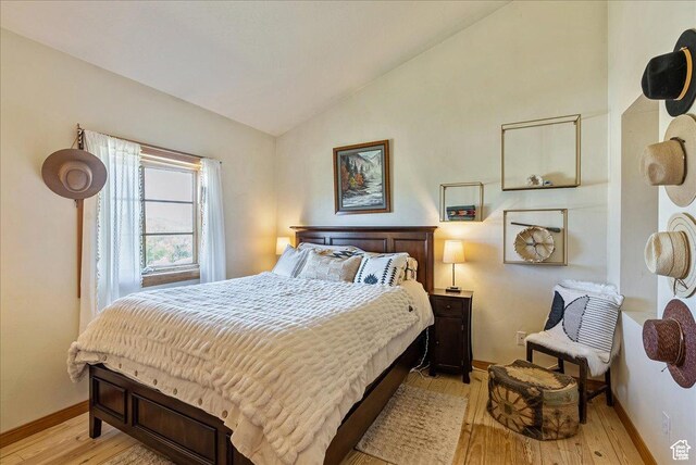 1071 S Foothill Dr E Unit 1, Kamas, UT 84036 - bedroom featuring vaulted ceiling, light wood finished floors, and baseboards