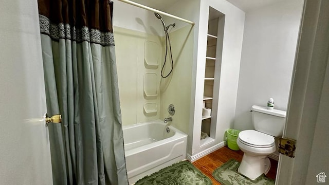 bathroom with shower / bath combo with shower curtain, toilet, and wood finished floors