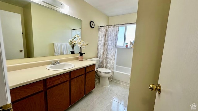 full bathroom featuring toilet, tile patterned floors, vanity, and shower / bath combo