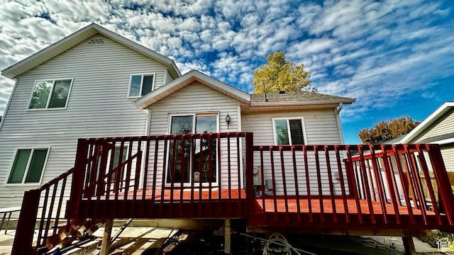 back of house featuring a deck