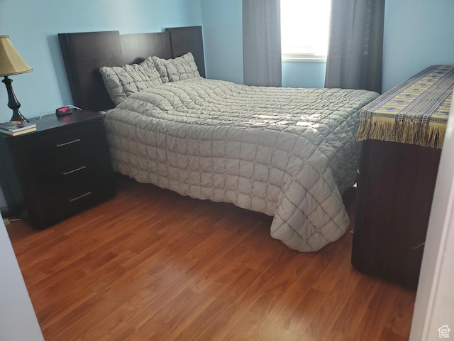 bedroom featuring wood finished floors