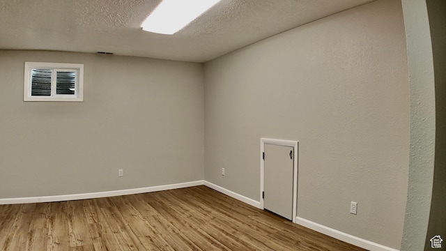 651 E 2160 N, North Logan, UT 84341 - spare room featuring a textured ceiling, baseboards, visible vents, and wood finished floors