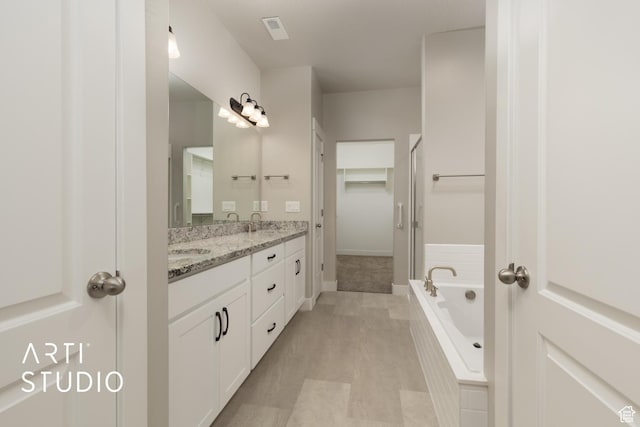 814 E 110 S, Salem, UT 84653 - full bath featuring a sink, visible vents, double vanity, baseboards, and a bath