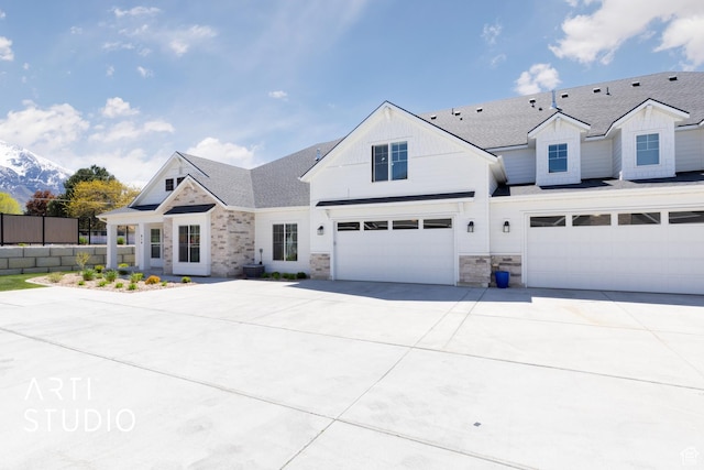 814 E 110 S, Salem, UT 84653 - view of front of house featuring driveway, board and batten siding, fence, an attached garage, and stone siding