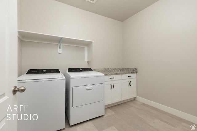 814 E 110 S, Salem, UT 84653 - laundry area featuring baseboards, light wood finished floors, washing machine and dryer, and cabinet space