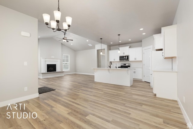 814 E 110 S, Salem, UT 84653 - kitchen with recessed lighting, ceiling fan with notable chandelier, open floor plan, light wood-style floors, and appliances with stainless steel finishes