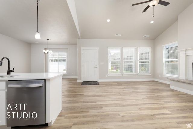 814 E 110 S, Salem, UT 84653 - kitchen featuring stainless steel dishwasher, a sink, ceiling fan with notable chandelier, open floor plan, and light countertops