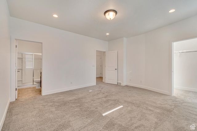 unfurnished bedroom with recessed lighting, baseboards, and carpet floors