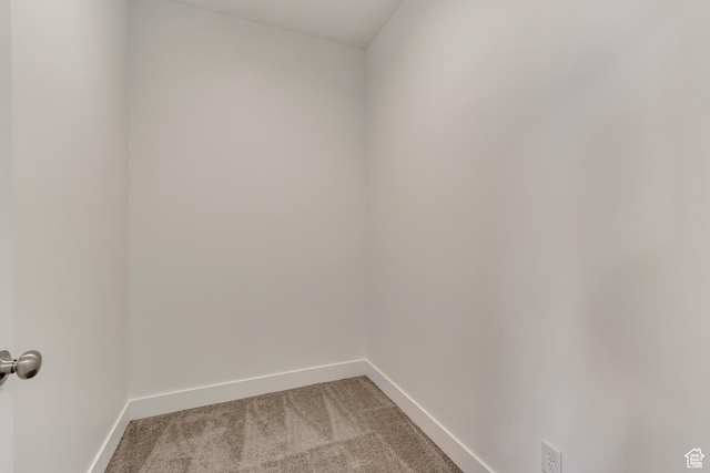 interior space with light colored carpet and baseboards