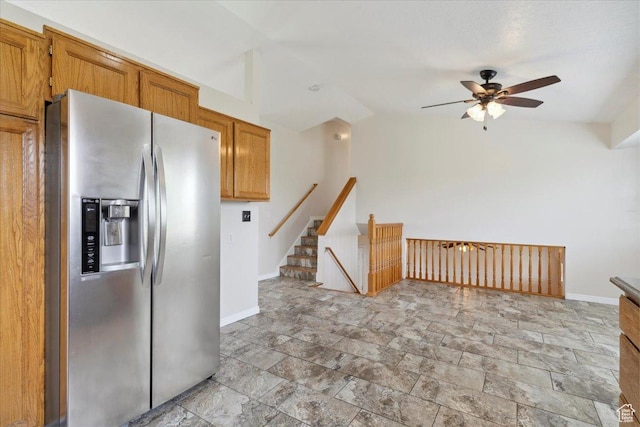 3035 N 2575 W, Farr West, UT 84404 - kitchen featuring stone tile floors, stainless steel fridge, a ceiling fan, and baseboards