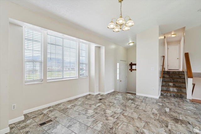 3035 N 2575 W, Farr West, UT 84404 - interior space with visible vents, baseboards, stairway, and a notable chandelier