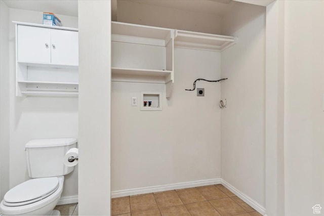 3035 N 2575 W, Farr West, UT 84404 - washroom featuring light tile patterned floors, electric dryer hookup, laundry area, washer hookup, and baseboards