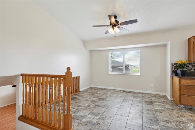 3035 N 2575 W, Farr West, UT 84404 - unfurnished room with baseboards, stone finish flooring, and ceiling fan