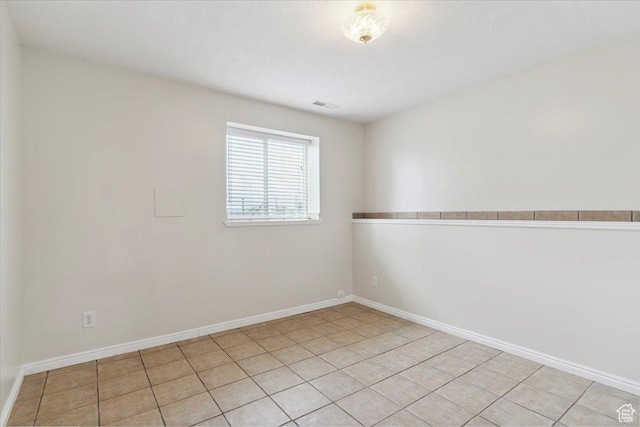 3035 N 2575 W, Farr West, UT 84404 - spare room featuring light tile patterned floors, visible vents, and baseboards