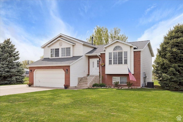 3035 N 2575 W, Farr West, UT 84404 - raised ranch with driveway, brick siding, a garage, a front yard, and roof with shingles