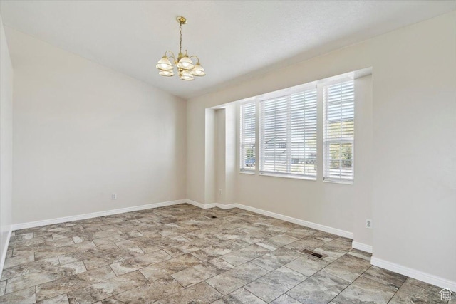 3035 N 2575 W, Farr West, UT 84404 - empty room with baseboards, stone finish flooring, an inviting chandelier, visible vents, and vaulted ceiling