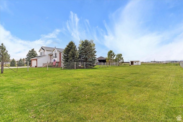 3035 N 2575 W, Farr West, UT 84404 - view of yard featuring fence and a garage