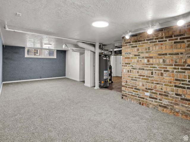 1362 Marilyn Dr, Ogden, UT 84403 - finished basement featuring a textured ceiling, carpet floors, gas water heater, and baseboards