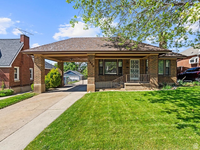1362 Marilyn Dr, Ogden, UT 84403 - view of front of property featuring driveway, a front yard, brick siding, a carport, and a gate