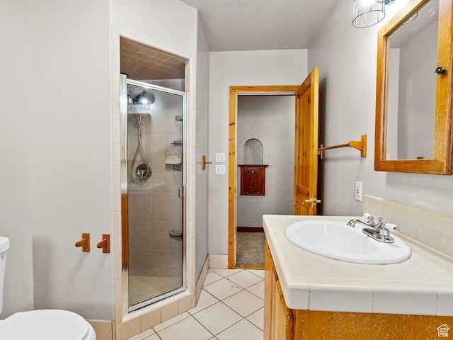 1362 Marilyn Dr, Ogden, UT 84403 - full bathroom featuring toilet, a shower stall, tile patterned floors, and baseboards