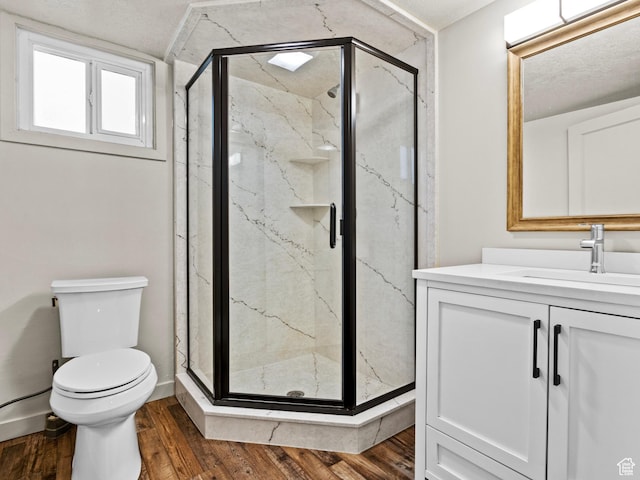 1362 Marilyn Dr, Ogden, UT 84403 - bathroom with wood finished floors, a marble finish shower, toilet, and vanity