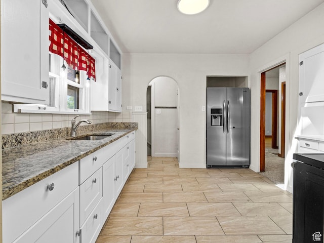 1362 Marilyn Dr, Ogden, UT 84403 - kitchen featuring stainless steel fridge with ice dispenser, a sink, white cabinetry, and light stone countertops