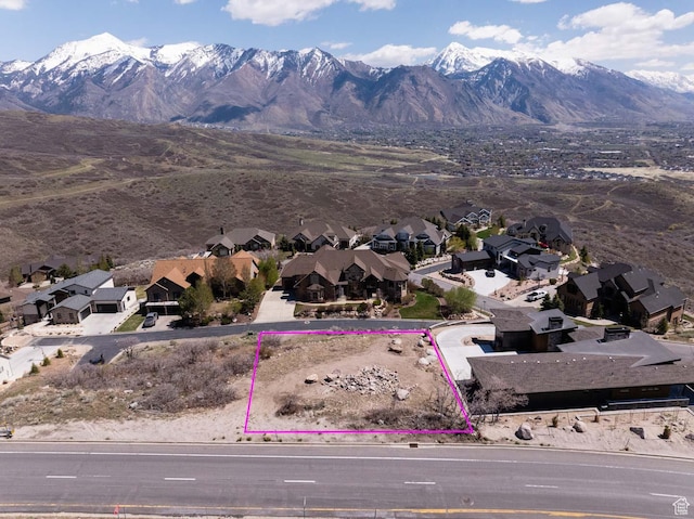 aerial view of residential area with mountains