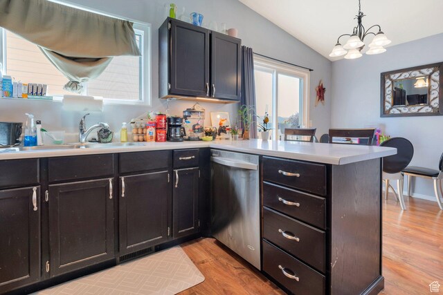 7947 S Linton Dr W, West Jordan, UT 84088 - kitchen featuring a sink, a peninsula, dishwasher, vaulted ceiling, and light wood finished floors