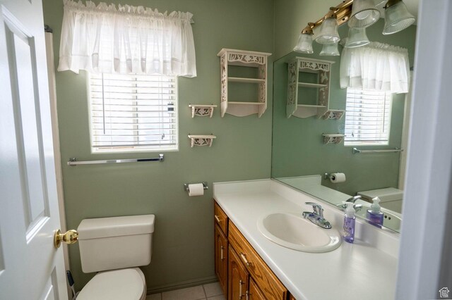 1090 E 700 S Unit 16, St George, UT 84790 - half bathroom featuring toilet, tile patterned flooring, and vanity