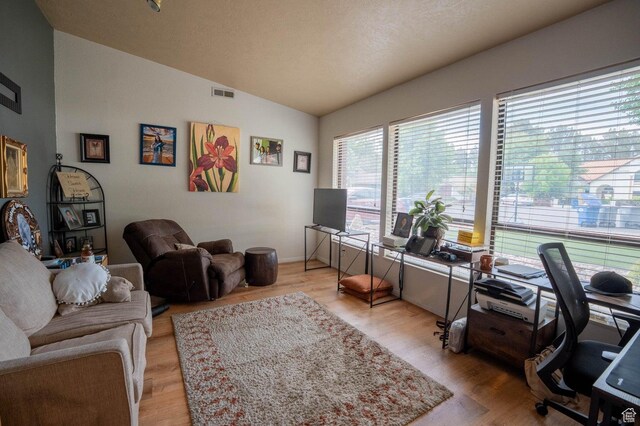 944 Gardenia Cir, St George, UT 84790 - office area featuring light wood finished floors, vaulted ceiling, baseboards, and visible vents