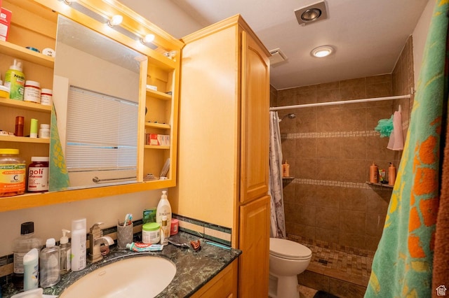 944 Gardenia Cir, St George, UT 84790 - bathroom featuring vanity, toilet, tiled shower, and visible vents