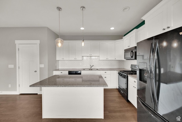 94 S Walker Ln, North Salt Lake, UT 84054 - kitchen featuring black appliances, a kitchen island, stone counters, backsplash, and dark wood-type flooring