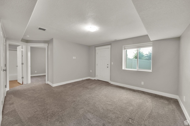 94 S Walker Ln, North Salt Lake, UT 84054 - unfurnished room with a textured ceiling, carpet, and baseboards