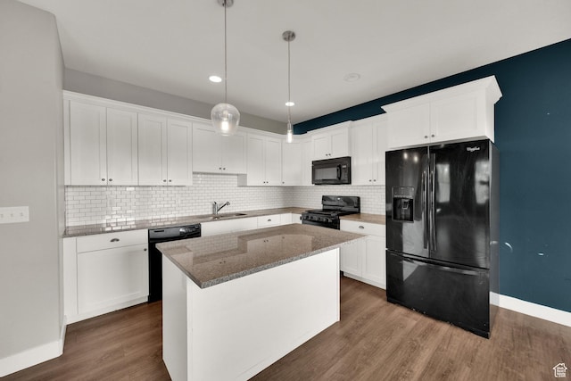 94 S Walker Ln, North Salt Lake, UT 84054 - kitchen featuring black appliances, white cabinets, dark wood-style floors, decorative backsplash, and stone countertops