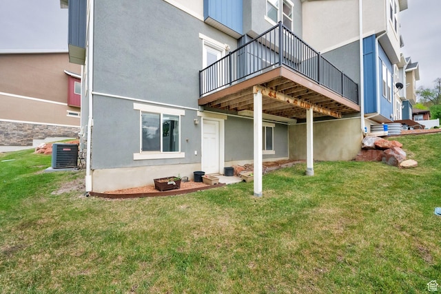 94 S Walker Ln, North Salt Lake, UT 84054 - back of house with a yard, central air condition unit, stucco siding, and a deck
