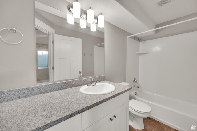 94 S Walker Ln, North Salt Lake, UT 84054 - bathroom with washtub / shower combination, vanity, toilet, and wood finished floors