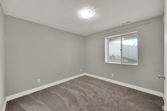 94 S Walker Ln, North Salt Lake, UT 84054 - spare room with carpet flooring, a textured ceiling, and baseboards