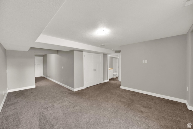 94 S Walker Ln, North Salt Lake, UT 84054 - finished below grade area featuring dark carpet, baseboards, and a textured ceiling