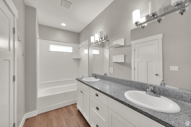 94 S Walker Ln, North Salt Lake, UT 84054 - full bathroom featuring double vanity, wood finished floors, and bathtub / shower combination