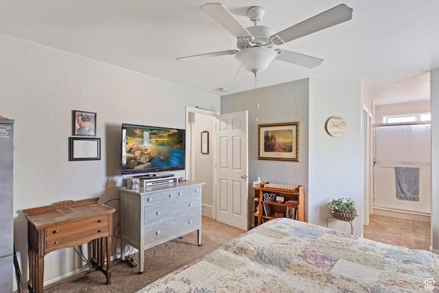 bedroom featuring light colored carpet and ceiling fan
