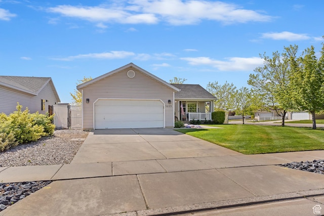 single story home featuring a gate, a garage, a front lawn, and driveway