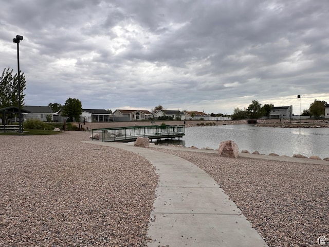 exterior space featuring a water view and a residential view