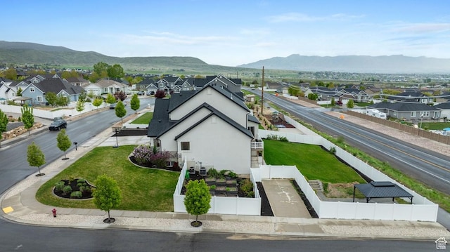 drone / aerial view with a mountain view and a residential view