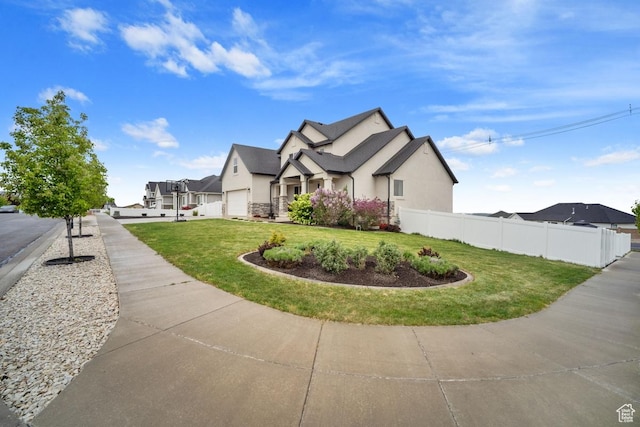 view of side of property with a yard, fence, and stucco siding