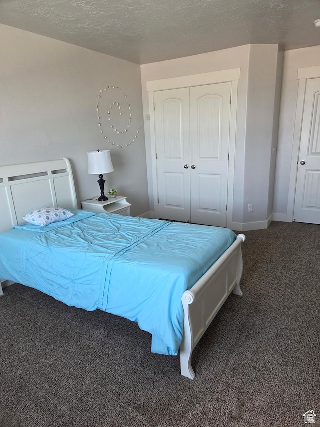 125 E Christley Ln, Elk Ridge, UT 84651 - bedroom with carpet, a closet, baseboards, and a textured ceiling