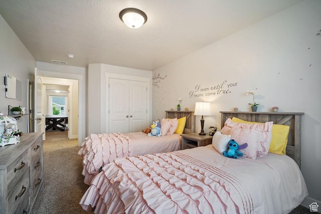 carpeted bedroom with a closet